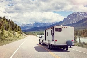 a car towing a trailer