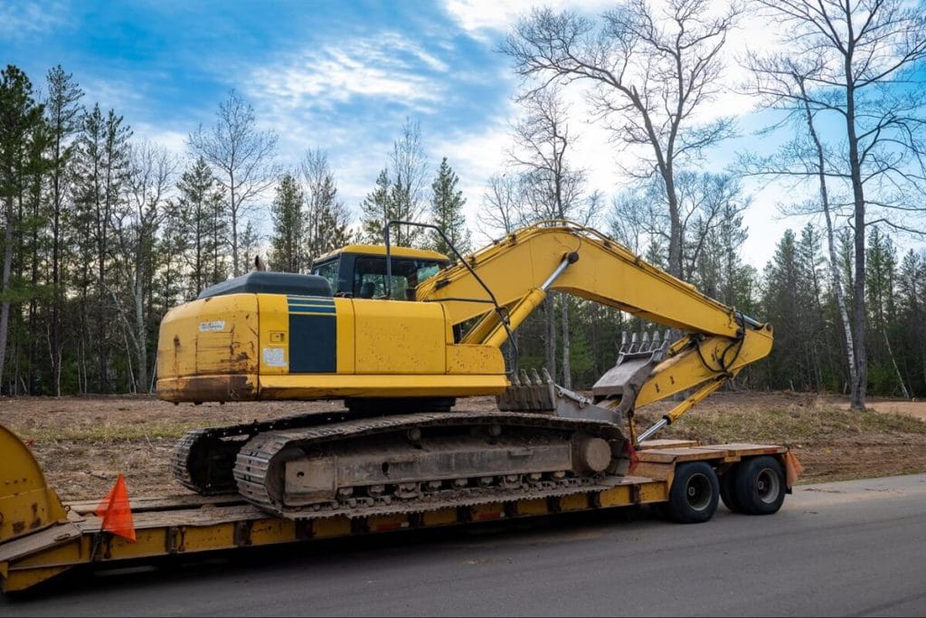 a skid steer on a trailer